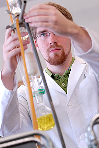 Picture of Augsburg's Brian Krohn at work in the chemistry lab.