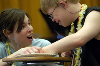 Picture of a Music Therapy student working with a middle schooler.