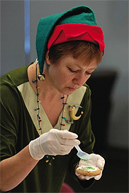 Picture of staff member decorating cookie