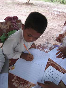 picture of young boy writing